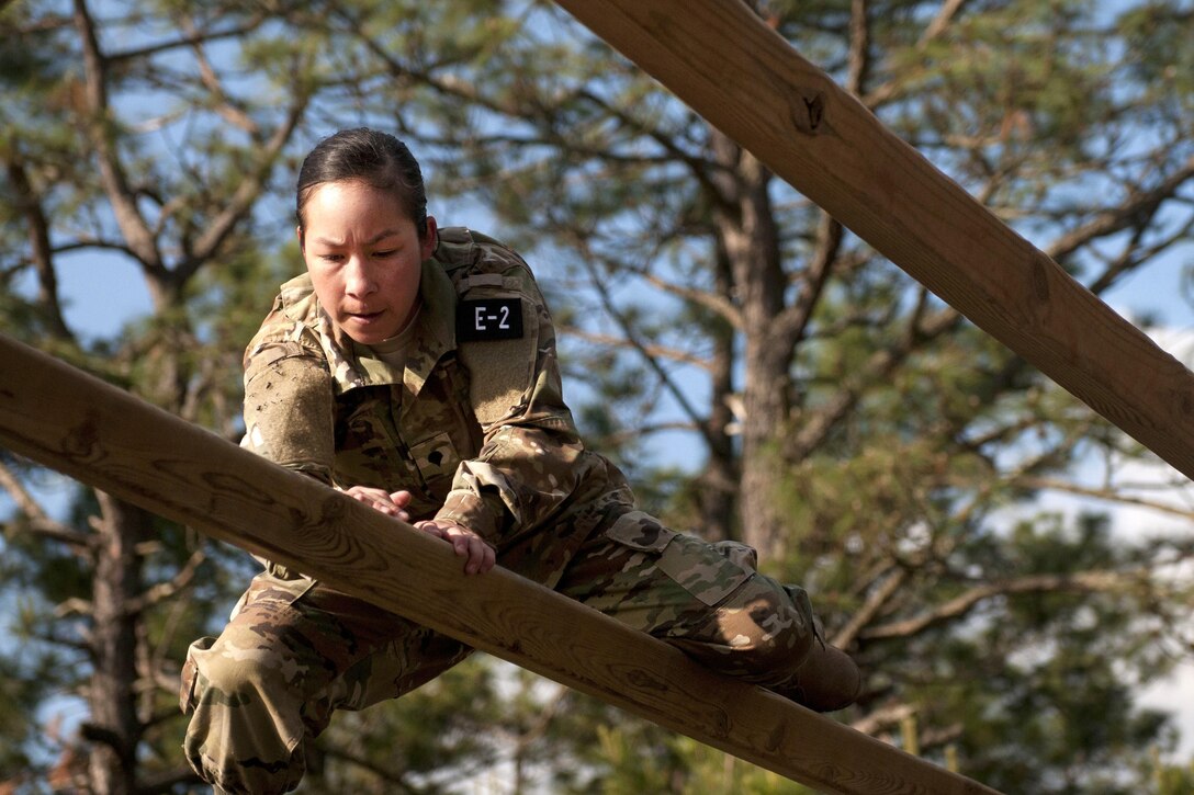 Army Spc. Kayla Bundy navigates an obstacle during the 2016 U.S. Army Reserve Best Warrior Competition at Fort Bragg, N.C., May 4, 2016. Bundy is a wheeled vehicle mechanic assigned to the 108th Training Command. Army photo by William K. Gillespie