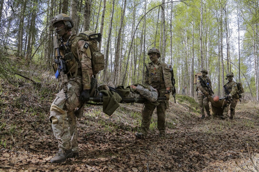 Pararescuemen evacuate simulated casualties in mass casualty search and rescue training at Joint Base Elmendorf-Richardson, Alaska, May 4, 2016. Air Force photo by Alejandro Pena