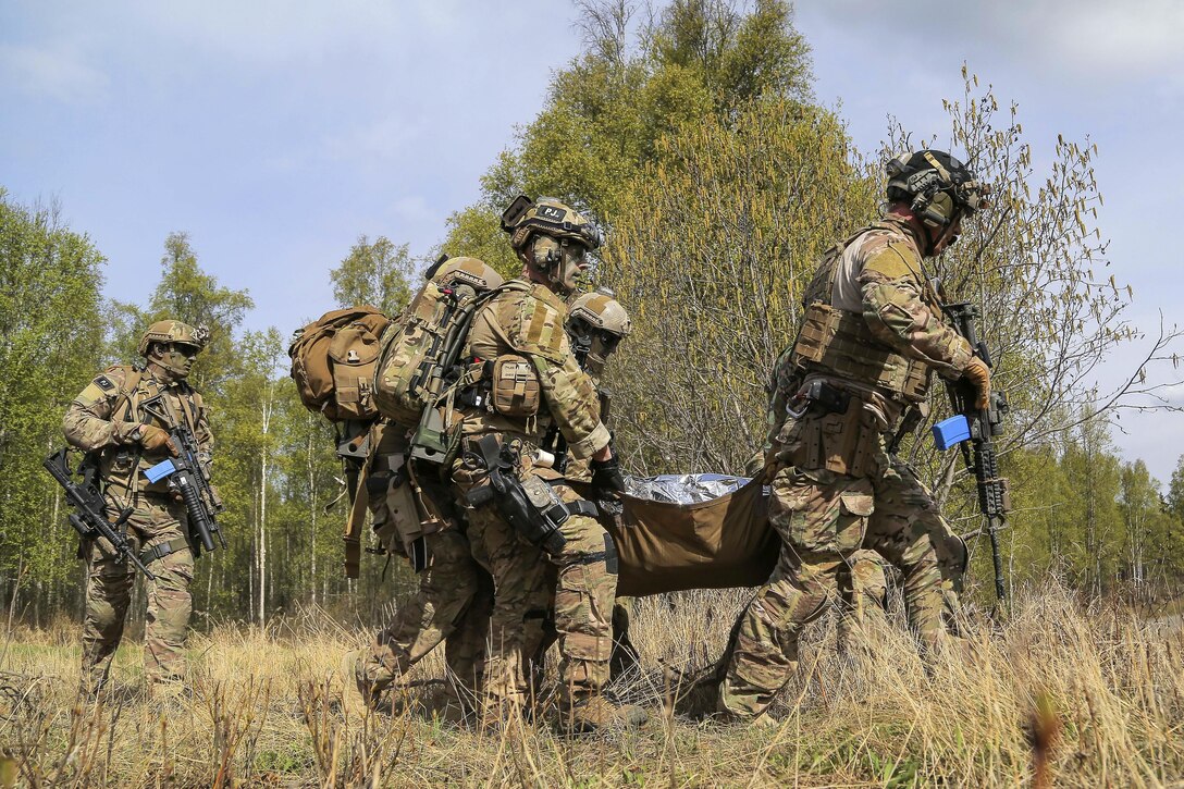 Pararescuemen evacuate a simulated casualty during mass casualty search and rescue training at Joint Base Elmendorf-Richardson, Alaska, May 4, 2016. Air Force photo by Alejandro Pena