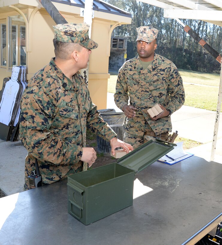Master Sgt. Roberto Nolasco (left), operations and training chief, Military Operations and Training Branch, and Sgt. Tavarez Hayman, ammunition technician, Logistics Support Division, Marine Corps Logistics Base Albany, prepare to distribute ammo to Marines, Sailors and Marine Corps police officers taking the Combat Pistol Program course of fire qualification at MCLB Albany. The CPP training is one of several scheduled and conducted on the installation’s pistol range to facilitate annual qualification requirements for service members and law enforcement personnel.