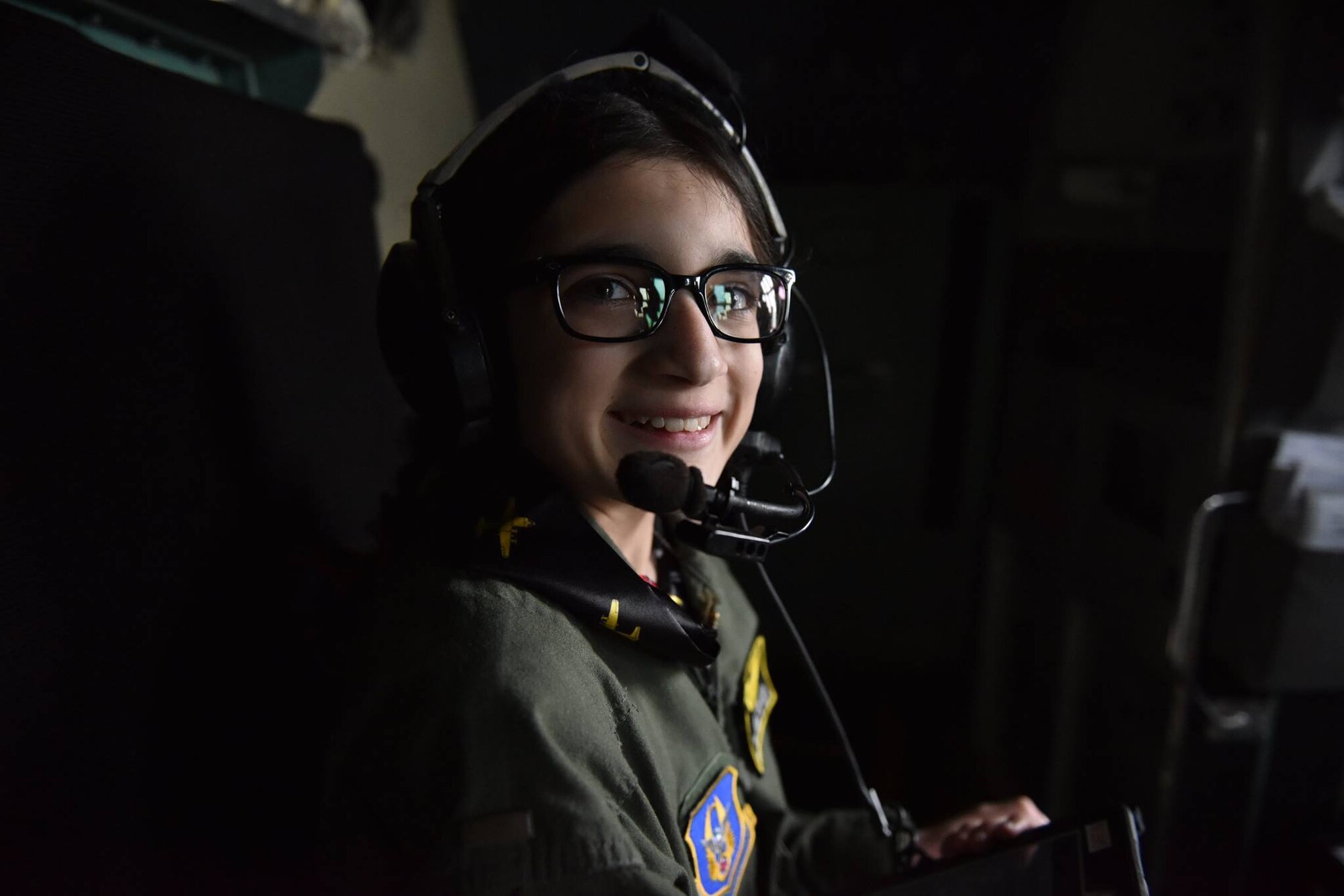 12 year-old Norah Carter, honorary second lieutenant of the 911th Airlift Wing, sits in the cockpit of a C-130 Hercules aircraft at the Pittsburgh International Air Reserve Station, May 11, 2016. Norah was nominated for the Pilot for a Day program by her doctors with the Allegheny Health Network, where she is being treated for an undiagnosed genetic disorder. (U.S. Air Force Photo by Airman Bethany Feenstra)