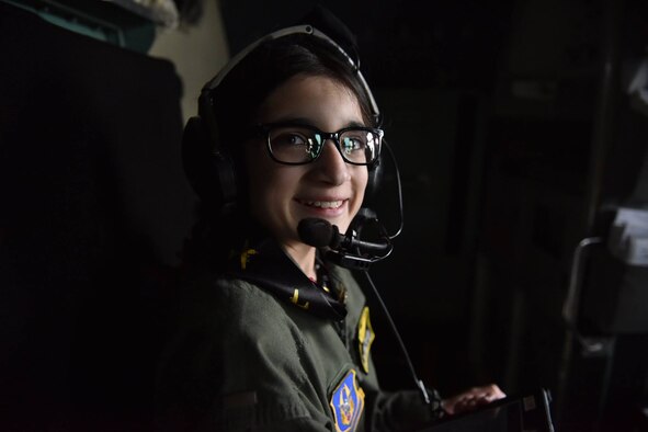 12 year-old Norah Carter, honorary second lieutenant of the 911th Airlift Wing, sits in the cockpit of a C-130 Hercules aircraft at the Pittsburgh International Air Reserve Station, May 11, 2016. Norah was nominated for the Pilot for a Day program by her doctors with the Allegheny Health Network, where she is being treated for an undiagnosed genetic disorder. (U.S. Air Force photo by Airman Bethany Feenstra)