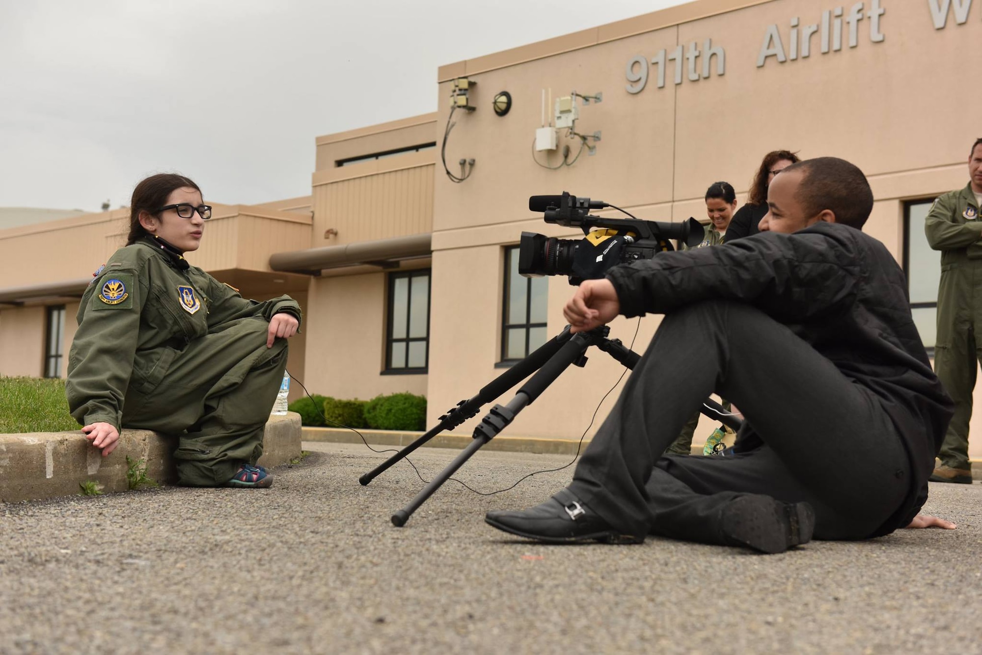 12 year-old Norah Carter, honorary second lieutenant of the 911th Airlift Wing, is interviewed by a reporter with WPXI-TV at the Pittsburgh International Air Reserve Station, May 11, 2016. Norah was nominated for the Pilot for a Day program by her doctors with the Allegheny Health Network, where she is being treated for an undiagnosed genetic disorder. (U.S. Air Force photo by Airman Bethany Feenstra)
