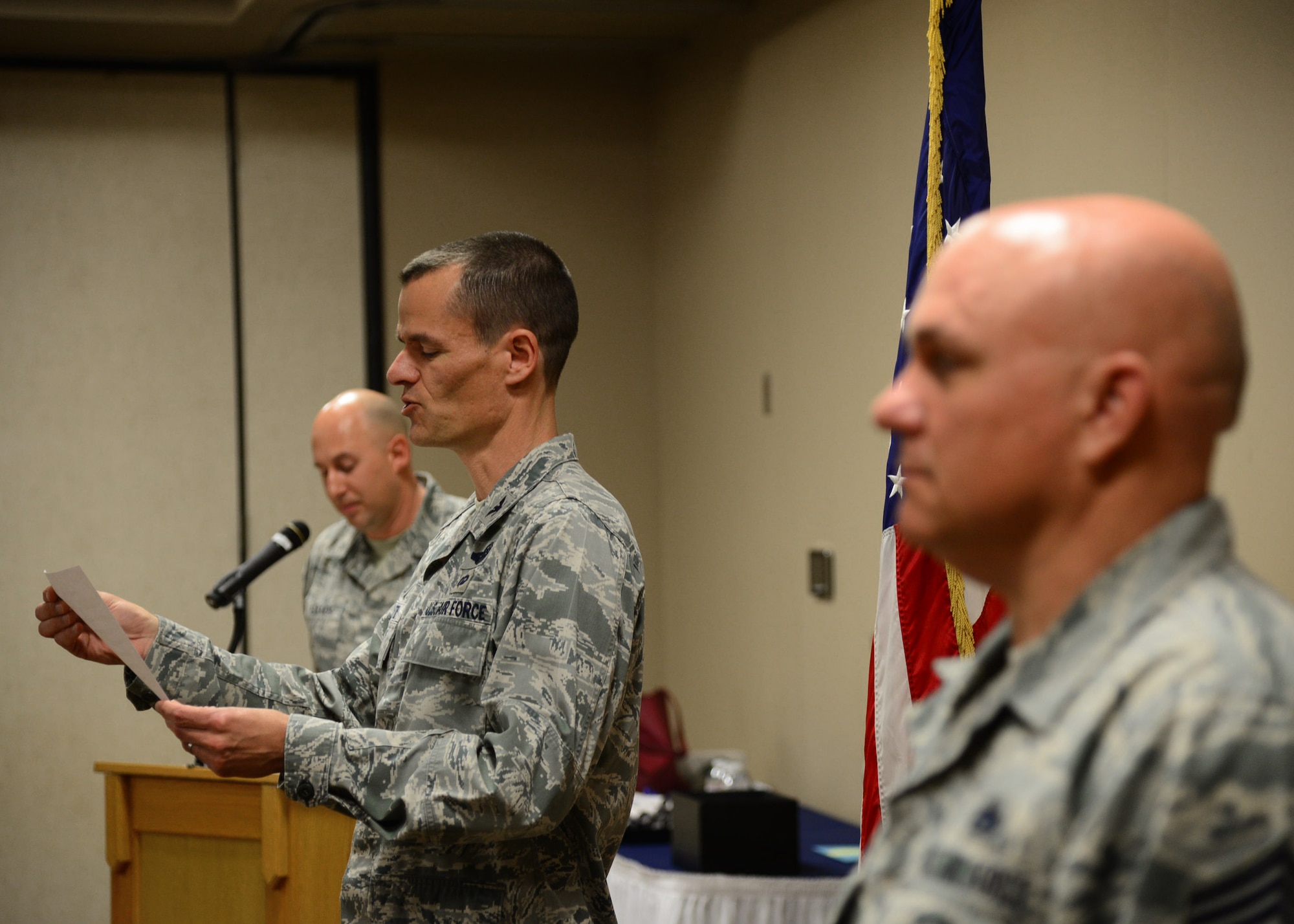 Col. Ben Maitre, 27th Special Operations Wing commander, officially graduates 33 Air Commandos by reading the Community College of the Air Force graduation decree May 13, 2016, at Cannon Air Force Base, N.M. Despite the challenges of working long hours, familial obligations and the high-intensity tempo of Air Force Special Operations Command, 129 Air Commandos went above and beyond this past graduation cycle to achieve this education milestone. (U.S. Air Force photo/Senior Airman Chip Slack)  