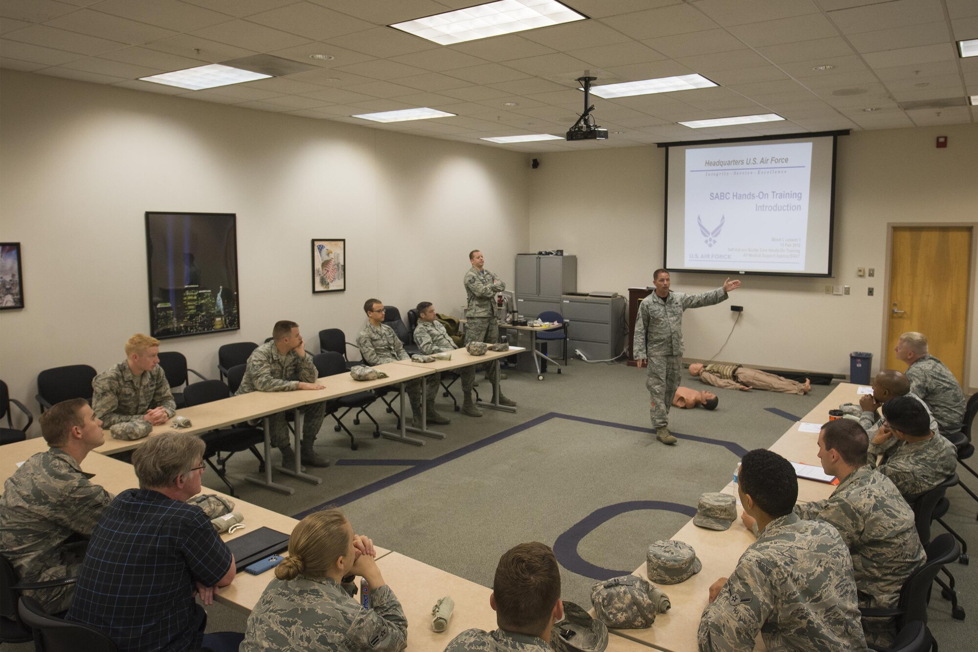 U.S. Air Force Tech. Sgt. Kevin Strickland, 23d Maintenance Operations Flight self-aid buddy care instructor, begins class with directions to handle an emergency, May 13, 2016, at Moody Air Force Base, Ga. Airmen were taught the different categories of bleeding and how to manage each of them during the SABC course. (U.S. Air Force photo by Airman Daniel Snider/Released)