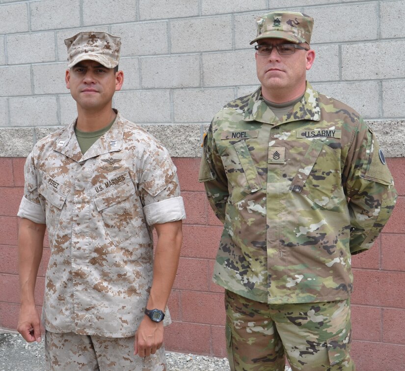 Capt. Albert Perez, 3rd Air Naval Gunfire Liaison Company officer in-charge, and Staff Sgt. William Noel, 729th Transportation Company non-commissioned officer in-charge, worked in a joint operations task at the U.S. Army Reserve Center, Bell, Calif., May 6, loading wheeled vehicles and equipment for Operation Maple Resolve, which is being conducted at Canadian Forces Base Wainwright, east of Edmonton, Canada. Operation Maple Resolve is the Canadian Forces largest training exercise of the year.