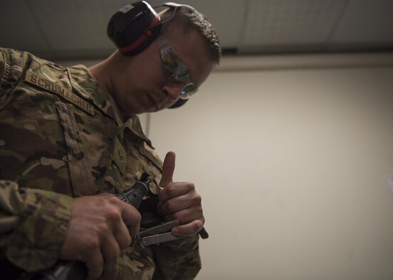 Senior Airman Addison Schumacher, 457th Expeditionary Fighter Squadron aircrew flight equipment technician, grinds away excess material for a face mask at Bagram Airfield, Afghanistan, May 15, 2016. Members of the 457th EFS/AFE ensure that Airmen have the supplies necessary for any situation, from packing emergency items like parachutes and survival kits to maintaining regularly used items like flight helmets and oxygen masks. (U.S. Air Force photo by Senior Airman Justyn M. Freeman)
