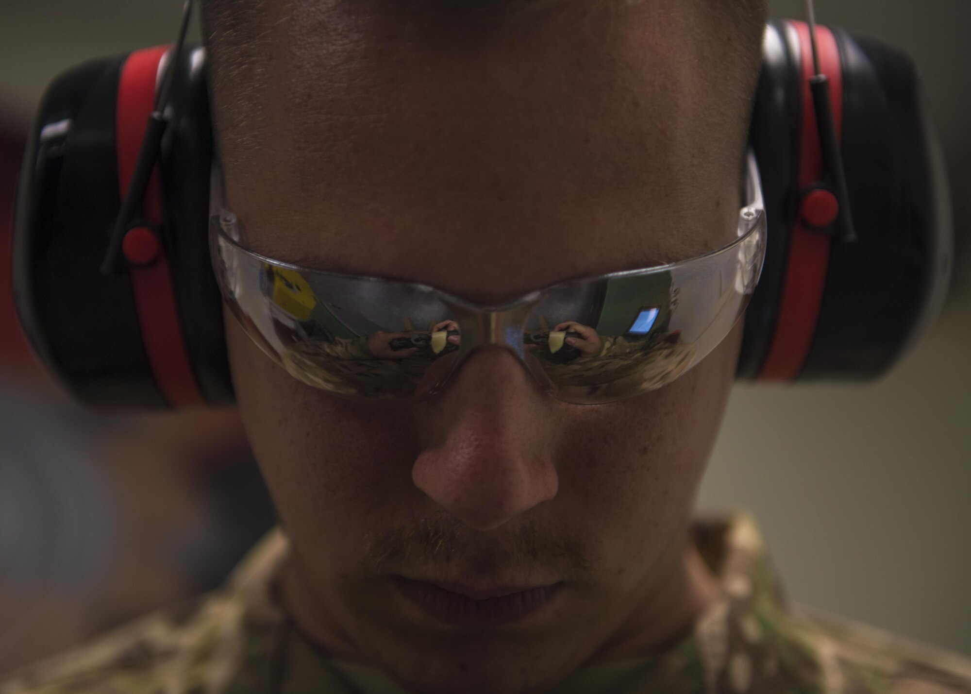 Senior Airman Addison Schumacher, 457th Expeditionary Fighter Squadron aircrew flight equipment technician, grinds away excess material for a face mask at Bagram Airfield, Afghanistan, May 15, 2016. AFE technicians manage, performs, and schedule inspections, maintenance, and adjustments of assigned aircrew flight equipment, aircrew chemical defense equipment, associated supplies, and inventories assets. Schumacher comes to Bagram from the Naval Air Station Joint Reserve Base Fort Worth, Fort Worth, Texas. (U.S. Air Force photo by Senior Airman Justyn M. Freeman)