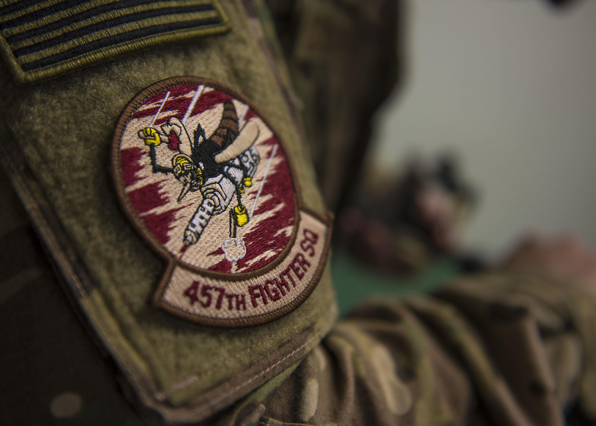 Senior Airman Addison Schumacher, 457th Expeditionary Fighter Squadron aircrew flight equipment technician, grinds away excess material for a face mask at Bagram Airfield, Afghanistan, May 15, 2016. Responsible for ensuring that all flight and safety equipment is in perfect working order, the attention to detail provided by these professionals could mean the difference between life and death. (U.S. Air Force photo by Senior Airman Justyn M. Freeman)
