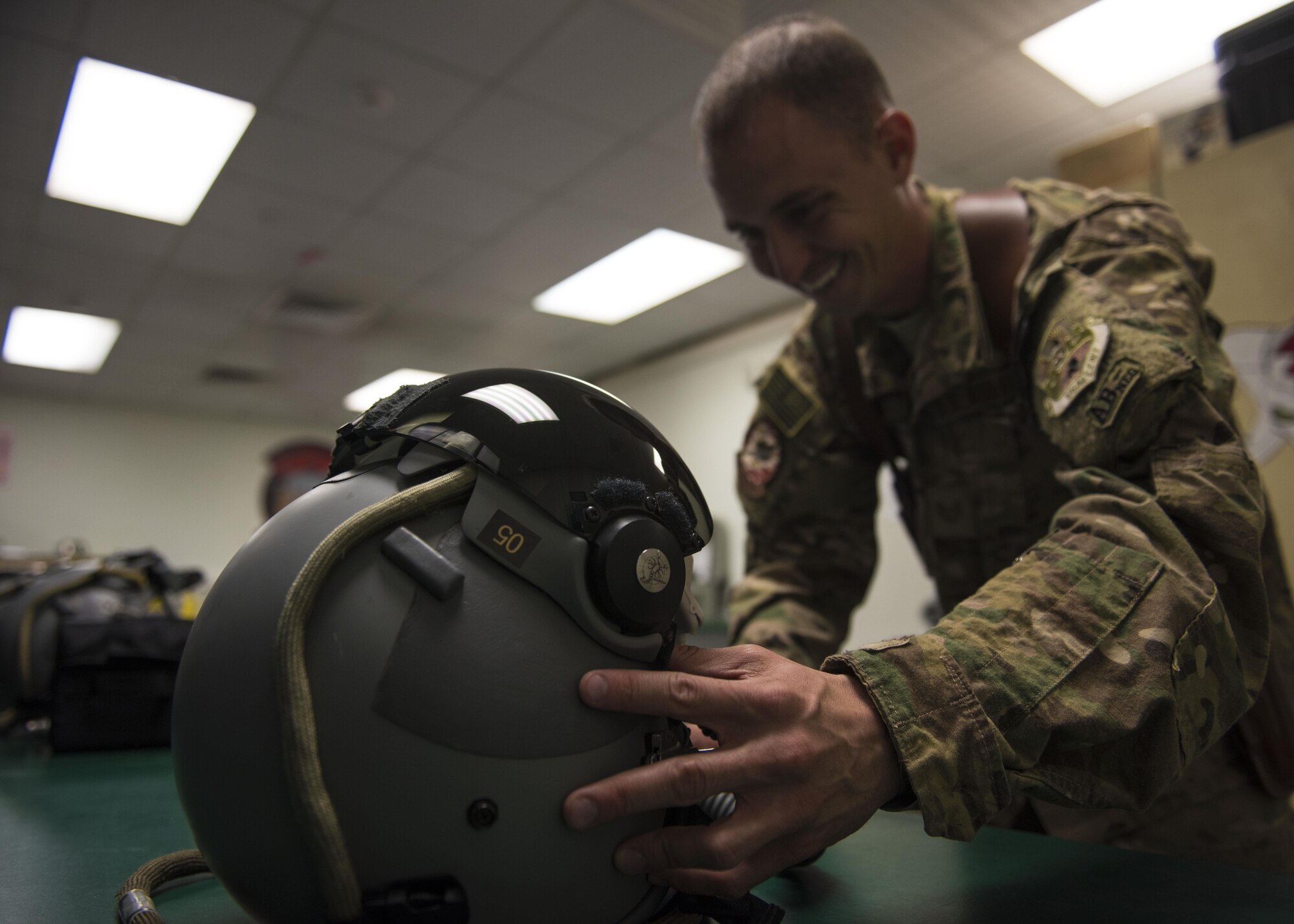 Technical Sgt. Rudolph Panacci, 457th Expeditionary Fighter Squadron aircrew flight equipment technician, assembles a fighter pilot's helmet at Bagram Airfield, Afghanistan, May 15, 2016. AFE technicians manage, performs, and schedule inspections, maintenance, and adjustments of assigned aircrew flight equipment, aircrew chemical defense equipment, associated supplies, and inventories assets. (U.S. Air Force photo by Senior Airman Justyn M. Freeman)