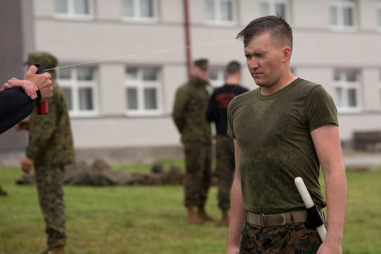 Cpl. Michael T. Langguth, a squad leader with 4th Law Enforcement Battalion, Force Headquarters Group, Marine Forces Reserve, participates in the oleoresin capsicum qualification training during exercise Platinum Wolf 16 at the Peacekeeping Operations Training Center South Base, Serbia, May 11, 2016. Platinum Wolf 16 is demonstrates the seamless integration of Reserve Marines with active component and enhances interoperability with partner nations in the region. (U.S. Marine Corps photo by Lance Cpl. Devan Alonzo Barnett)