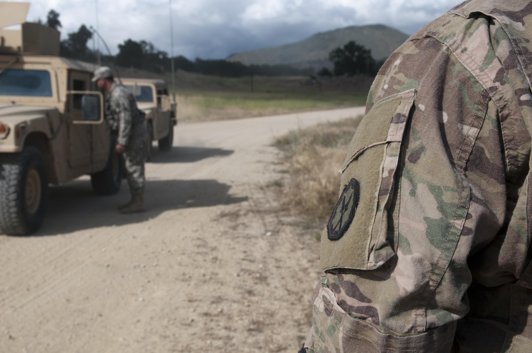 Fort Hunter-Liggett - U.S. Army Reserve Soldiers of the 351st MP Company, of Ocala, Florida, guard, and check paper work of Soldiers coming and going at Entry Control Point for one of the Forward Operating Bases at Fort Hunter-Liggett, Calif. for training exercise Warrior Exercise 2016 on May 5. The 351st MP Co. is conducting 24 hour operations of the Entry Control Point for the entire duration of WAREX. (U.S. Army photo by Sgt. Marco Gutierrez)