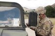 Fort Hunter-Liggett - U.S. Army Reserve avionic mechanic Spc. Alex Edwards a Military Police member from the 351st MP Company, of Ocala, Florida, guard, and check paper work of Soldiers coming and going at Entry Control Point for one of the Forward Operating Bases at Fort Hunter-Liggett, Calif. for training exercise Warrior Exercise 2016 on May 5. The 351st MP Co. is conducting 24 hour operations of the Entry Control Point for the entire duration of WAREX. (U.S. Army photo by Sgt. Marco Gutierrez)