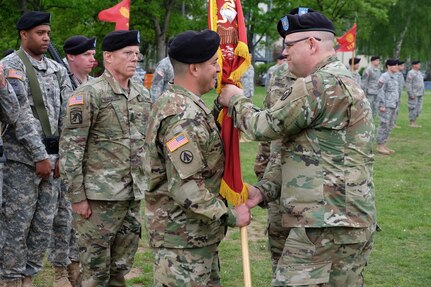 KAISERSLAUTERN, Germany-U.S. Army Reserve Soldiers from the 7th Mission Support Command and the 7th MSC’s 446th Transportation Battalion (Movement Control) conducted a change of command ceremony May 14, 2016.  Lt. Col. Robert Keck, the incoming commander of the 446th Transportation Battalion (MC), left, receives the unit colors from Col. Kevin M. Sanders, the deputy commander of the 7th MSC.