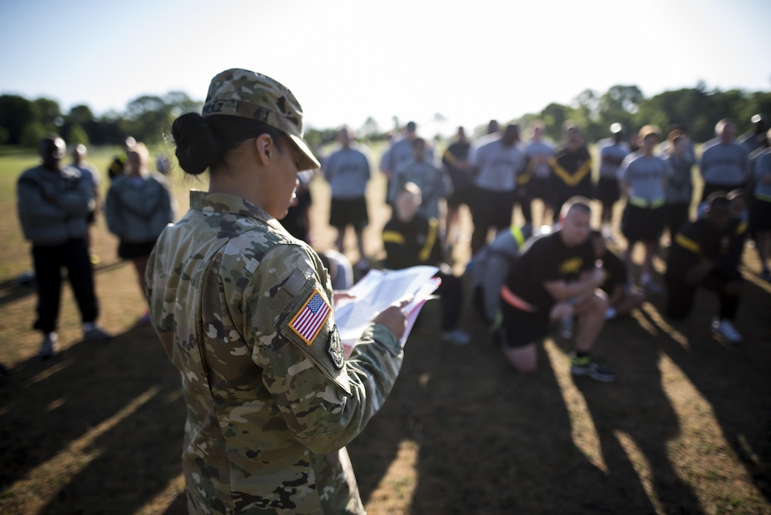 Sgt. 1st Class Tiffany Apholz, U.S. Army Reserve budget analyst for the 200th Military Police Command, gives the Army Physical Fitness Test's initial briefing to a group of Soldiers about to take the test, May 14, during battle assembly at Fort Meade, Maryland. (U.S. Army photo by Master Sgt. Michel Sauret)