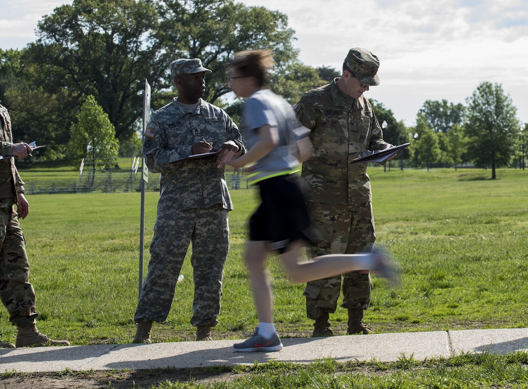 A U.S. Army Reserve Soldier from the 200th Military Police Command's headquarters company finishes the first lap of a two-mile run in the Army Physical Fitness Test, May 14, during battle assembly at Fort Meade, Maryland. (U.S. Army photo by Master Sgt. Michel Sauret)