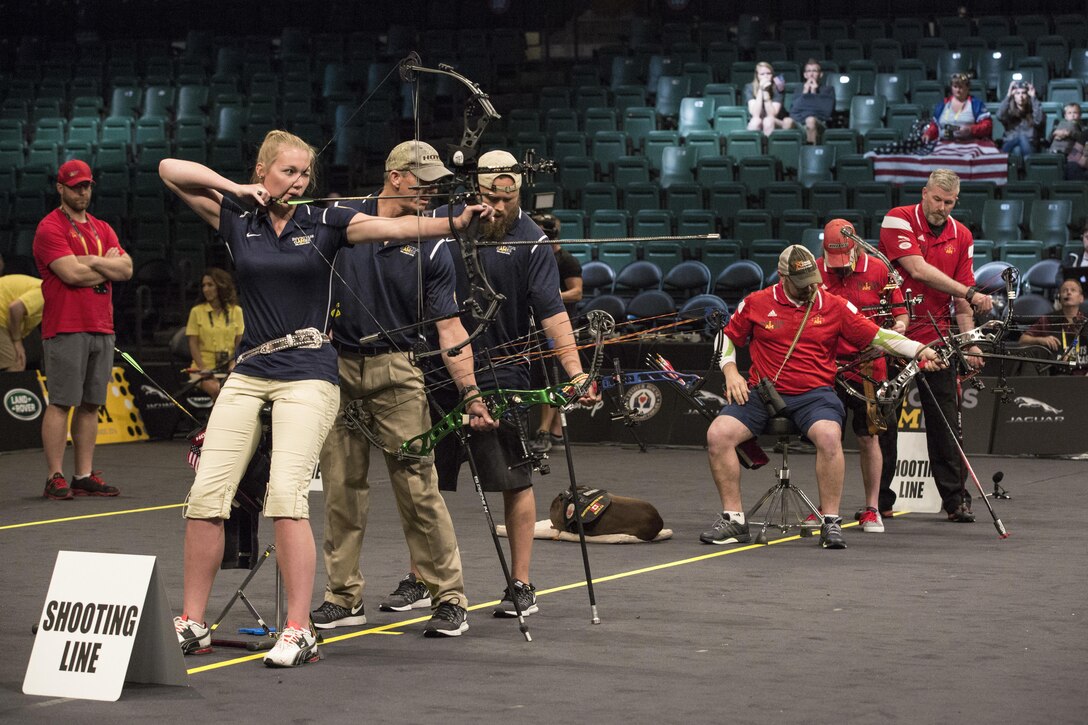 U.S. Army Reserves Spc. Chasity Kuczer, from Team U.S., aims at her target during the Invictus Games archery finals at Discover Disney's ESPN Wide World of Sports Complex in Orlando, Fla., May 9, 2016.  Kuczer helped her team win the gold by scoring a ten on the tie-breaker vs. Team Canada. (U.S. Army video by Pfc. Matthew J. DeVirgilio/Released)