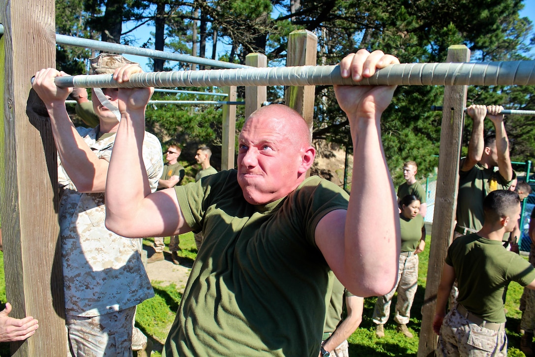 Marines from the Marine Corps Detachment give all they've got while conducting pull-ups during a physical training session aboard the Presidio of Monterey.  