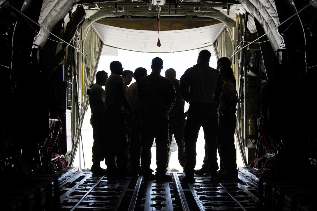 Air Force airmen and pararescuemen receive a mission and safety brief on the ramp of a C-130J Super Hercules aircraft before takeoff at Bagram Airfield, Afghanistan, April 28, 2016. The airmen are assigned to the 774th Expeditionary Airlift Squadron and the pararescuemen are assigned to the 83rd Expeditionary Rescue Squadron. Air Force photo by Senior Airman Justyn M. Freeman