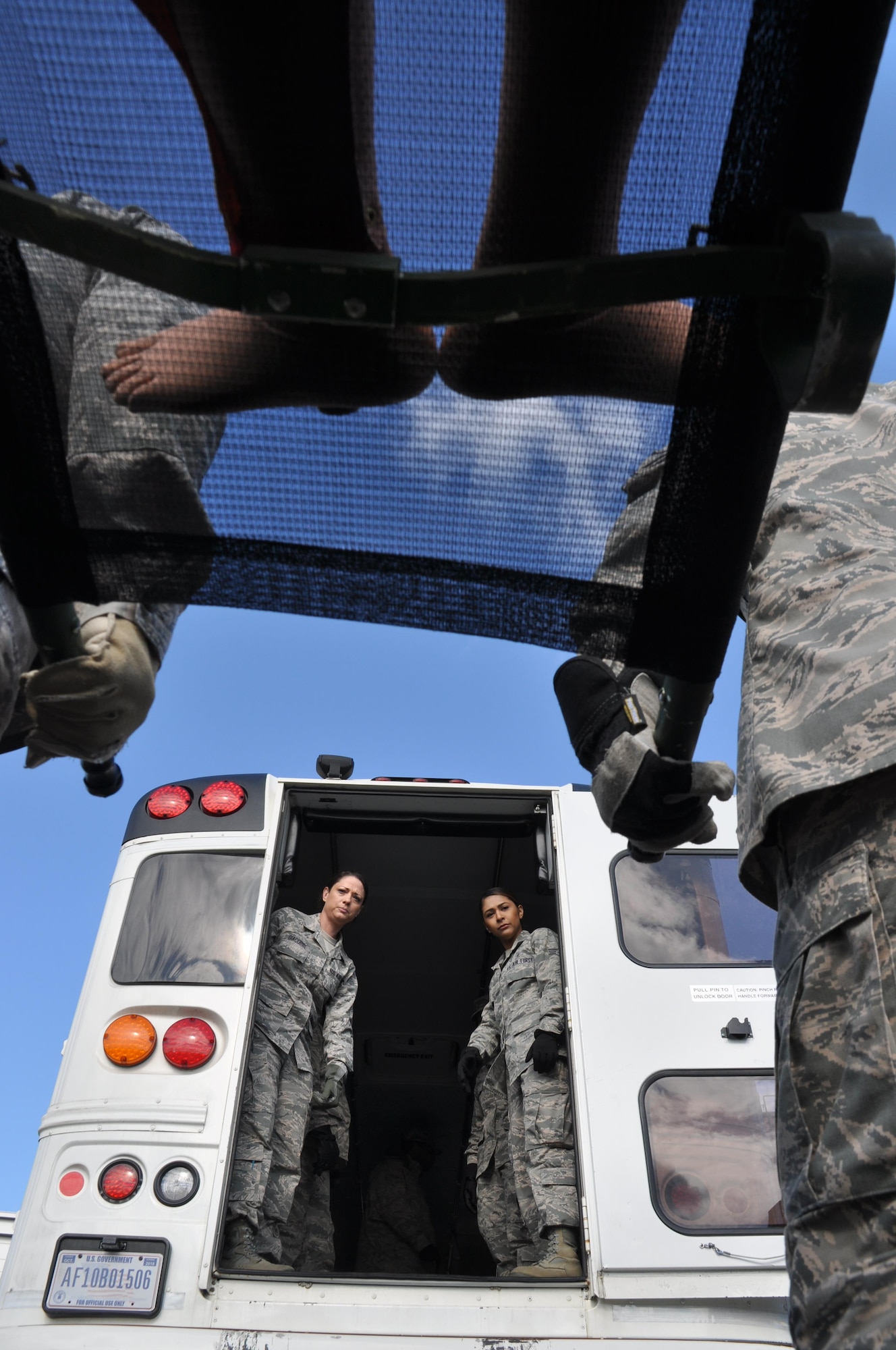 Members of the 459th Aeromedical Staging Squadron conduct litter carry training at Joint Base Andrews, Md., May 15, 2016.  The training was part of a two-hour exercise to practice the en route patient staging system.  (U.S. Air Force photo by/Tech. Sgt. Brent A. Skeen)