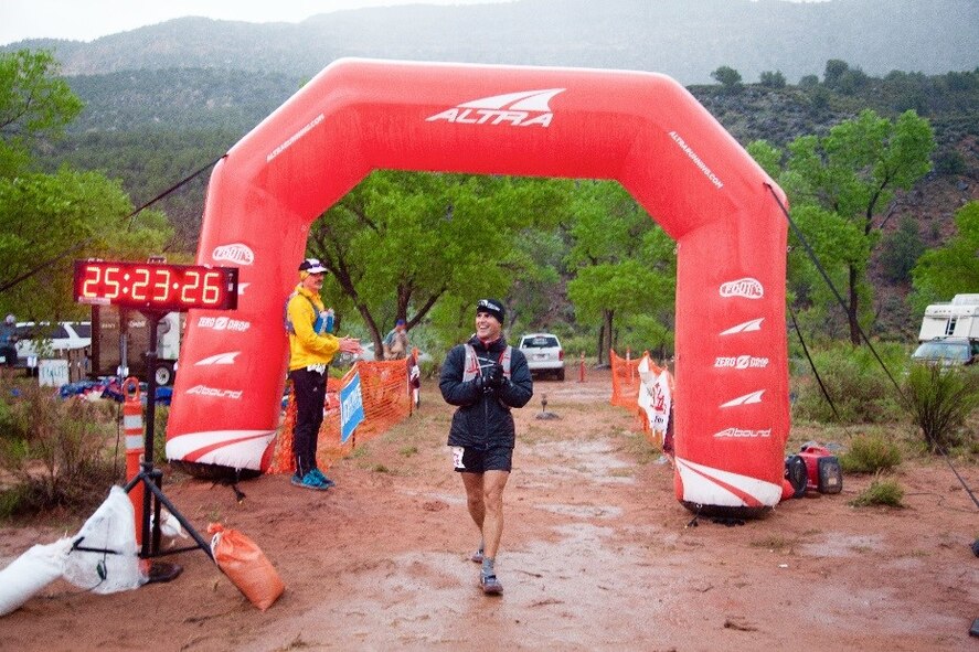 Maj. Peter Cossette, 944 Fighter Wing F-35 instructor pilot, passes the finish line after running the Zion 100 Mile Ultra Marathon along the outskirts of Zion National Park in Utah in just over 25 hours April 8-9. (Courtesy photo)