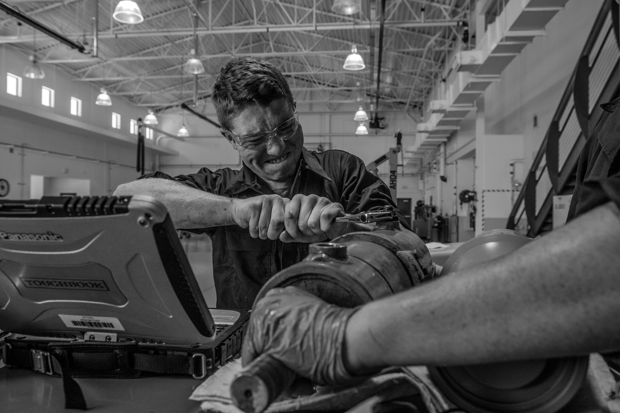 Senior Airman Tylor, 432nd Maintenance Squadron aerospace ground equipment AGE journeyman, turns a wrench on a hydraulic pump May 11, 2016, at Creech Air Force Base, Nevada. President Harry S. Truman led the effort to establish a single Armed Forces Day holiday for citizens to come together and thank our military members for their patriotic service in support of our country. (U.S. Air Force photo by Senior Airman Adarius Petty/Released)