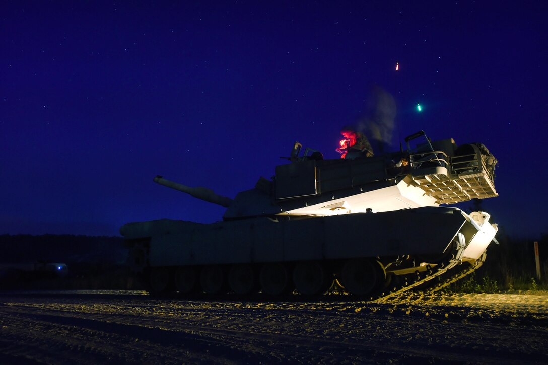 Soldiers wait inside an M1A1 Abrams tank on the ready line for their turn to fire during the Gen. Gordon Sullivan Cup best tank crew competition at Fort Benning, Ga., May 4, 2016. The soldiers are assigned to the North Carolina Army National Guard’s Company C, 1st Battalion, 252nd Armored Regiment. Army photo by Sgt. 1st Class Jon Soucy