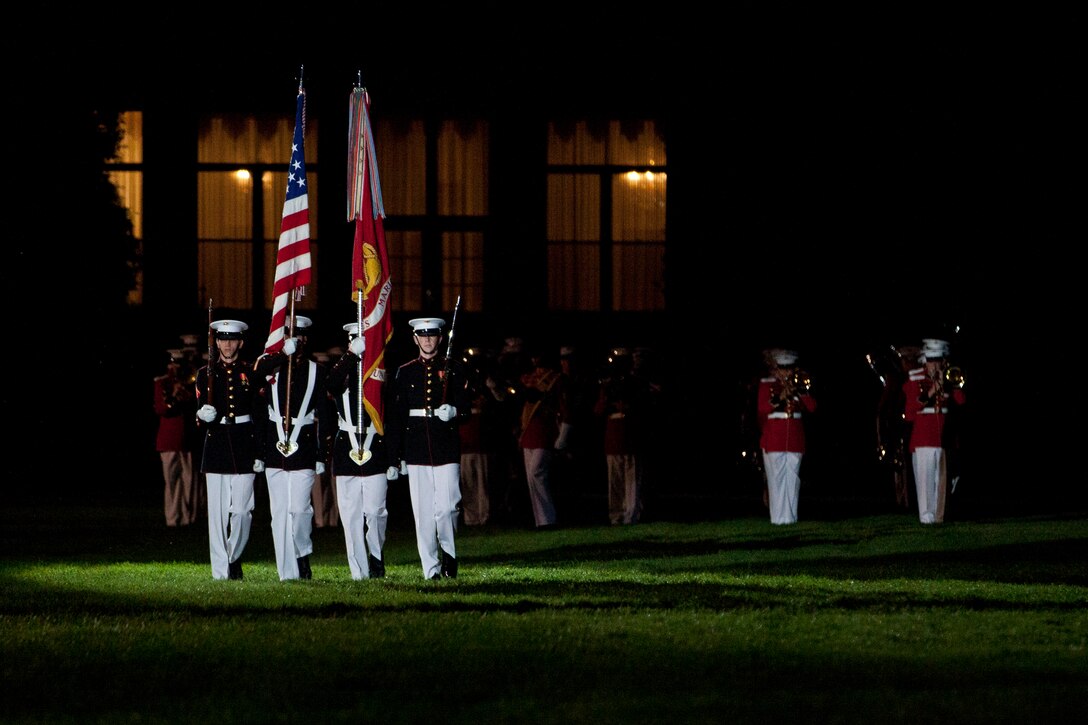 U.S. Marines with Marine Barracks Washington, D.C., march on the colors during the evening parade, May 13, 2016. Evening parades are held as a means of honoring senior officials, distinguished citizens and supporters of the Marine Corps. (U.S. Marine Corps photo by Pfc. Stephon L. McRae/ Released)
