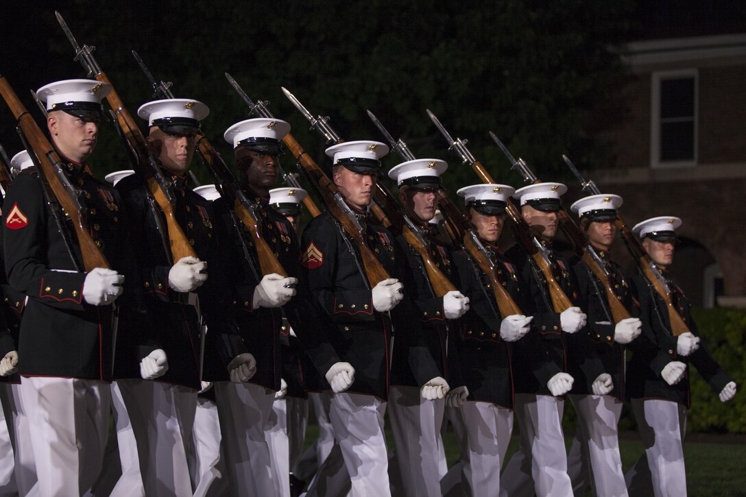 U.S. Marines with Marine Barracks Washington, D.C. conduct a pass in review during the evening parade at Marine Barracks Washington, D.C., May 13, 2016. Evening parades are held as a means of honoring senior officials, distinguished citizens and supporters of the Marine Corps. (U.S. Marine Corps photo by Cpl. Samantha K. Draughon/ Released)