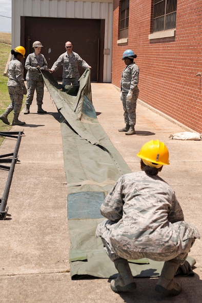 U.S. Air Force Reserve Airmen assigned to the 913th Force Support Squadron, participate in tent-building training during the 913th Airlift Group’s Unit Training Assembly weekend at Little Rock AFB, Ark., May 15, 2016. The hands-on training, which is required every 20 months, gives the Airmen experience with the equipment in the event they are deployed to a location with little or no support. (U.S. Air Force photo by Master Sgt. Jeff Walston/Released)    