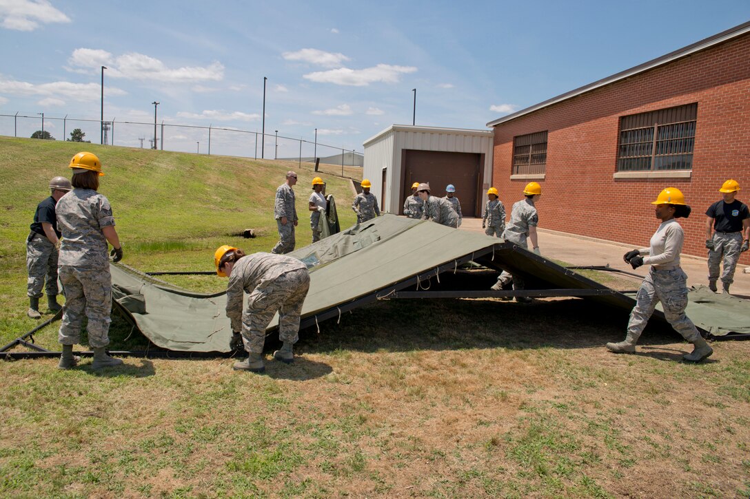 U.S. Air Force Reserve Airmen assigned to the 913th Force Support Squadron, participate in tent-building training during the 913th Airlift Group’s Unit Training Assembly weekend at Little Rock AFB, Ark., May 15, 2016. The hands-on training, which is required every 20 months, gives the Airmen experience with the equipment in the event they are deployed to a location with little or no support. (U.S. Air Force photo by Master Sgt. Jeff Walston/Released)    