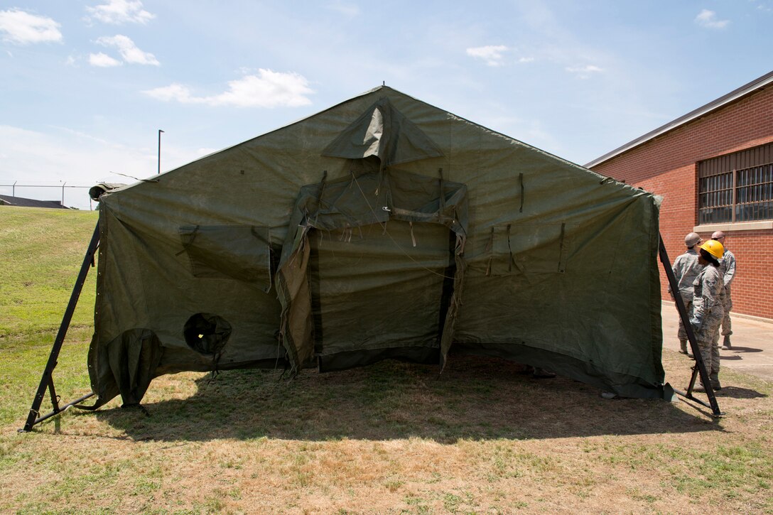 U.S. Air Force Reserve Airmen assigned to the 913th Force Support Squadron, participate in tent-building training during the 913th Airlift Group’s Unit Training Assembly weekend at Little Rock AFB, Ark., May 15, 2016. The hands-on training, which is required every 20 months, gives the Airmen experience with the equipment in the event they are deployed to a location with little or no support. (U.S. Air Force photo by Master Sgt. Jeff Walston/Released)    