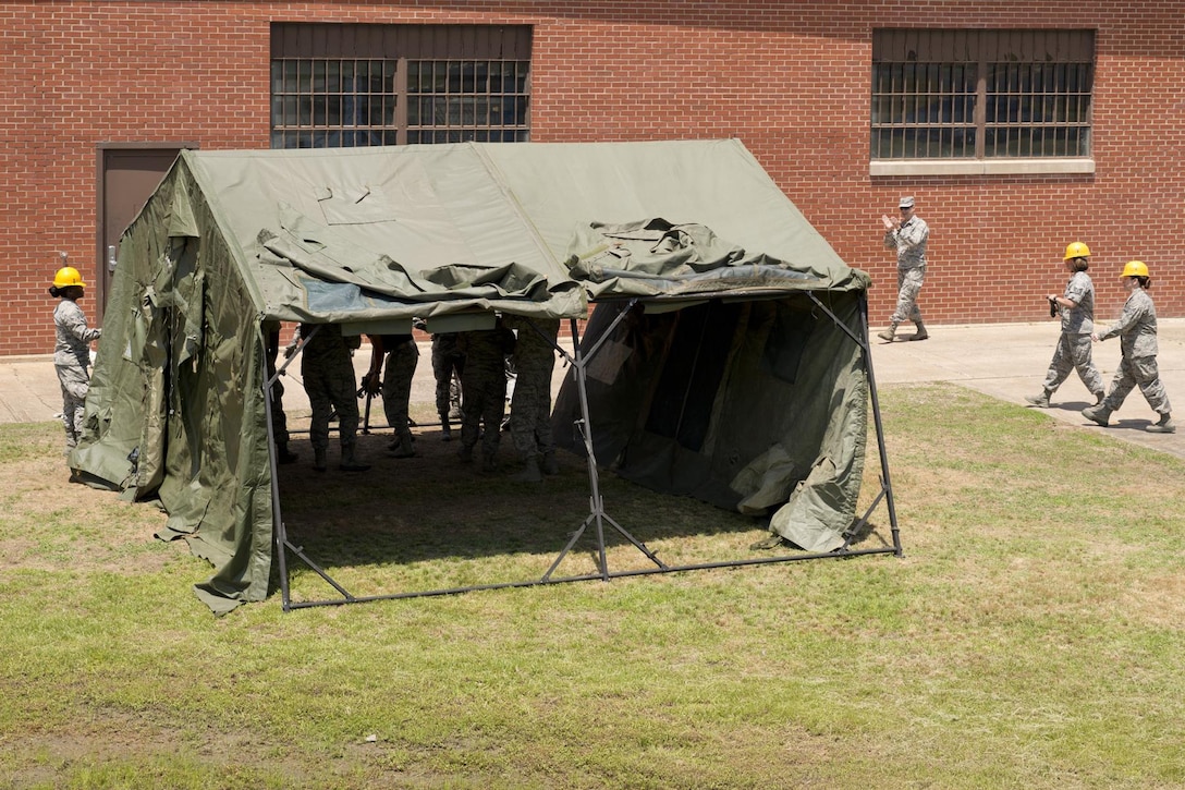 U.S. Air Force Reserve Airmen assigned to the 913th Force Support Squadron, participate in tent-building training during the 913th Airlift Group’s Unit Training Assembly weekend at Little Rock AFB, Ark., May 15, 2016. The hands-on training, which is required every 20 months, gives the Airmen experience with the equipment in the event they are deployed to a location with little or no support. (U.S. Air Force photo by Master Sgt. Jeff Walston/Released)    