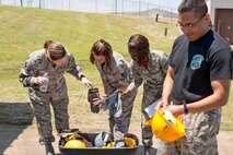 U.S. Air Force Reserve Airmen assigned to the 913th Force Support Squadron, choose their personal protective equipment before participating in tent-building training during the 913th Airlift Group’s Unit Training Assembly weekend at Little Rock AFB, Ark., May 15, 2016. The hands-on training, which is required every 20 months, gives the Airmen experience with the equipment in the event they are deployed to a location with little or no support. (U.S. Air Force photo by Master Sgt. Jeff Walston/Released) 