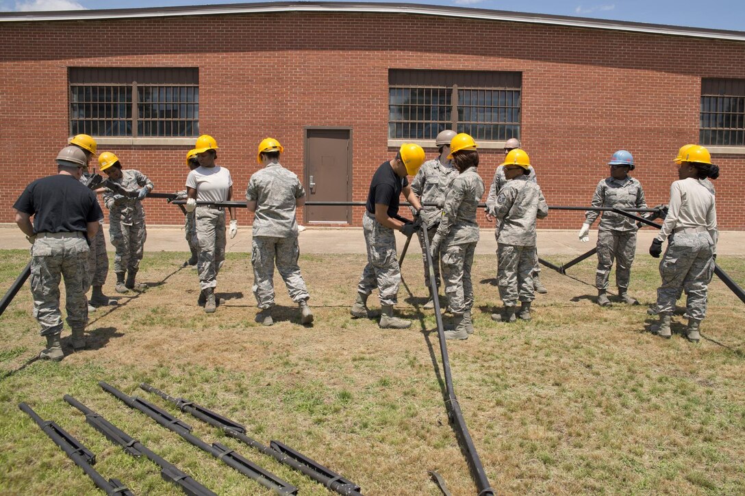 U.S. Air Force Reserve Airmen assigned to the 913th Force Support Squadron, participate in tent-building training during the 913th Airlift Group’s Unit Training Assembly weekend at Little Rock AFB, Ark., May 15, 2016. The hands-on training, which is required every 20 months, gives the Airmen experience with the equipment in the event they are deployed to a location with little or no support. (U.S. Air Force photo by Master Sgt. Jeff Walston/Released)    