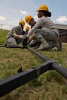 U.S. Air Force Reserve Airmen assigned to the 913th Force Support Squadron, piece together sections of framing during tent-building training at the 913th Airlift Group’s Unit Training Assembly weekend at Little Rock AFB, Ark., May 15, 2016. The hands-on training, which is required every 20 months, gives the Airmen experience with the equipment in the event they are deployed to a location with little or no support. (U.S. Air Force photo by Master Sgt. Jeff Walston/Released) 