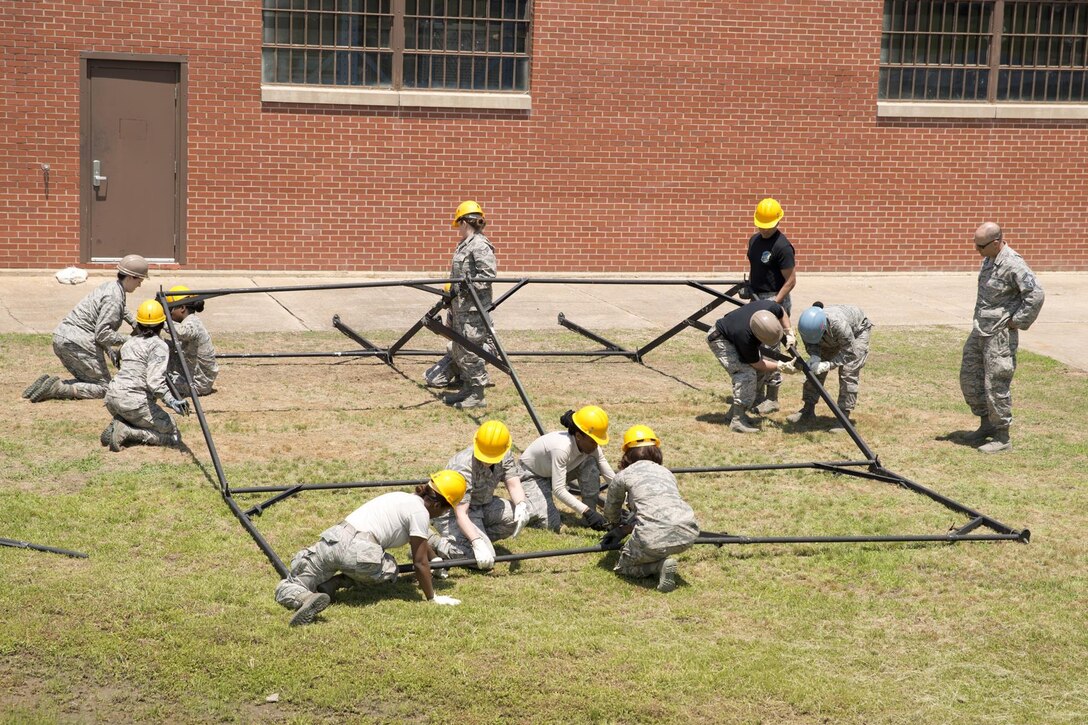 U.S. Air Force Reserve Airmen assigned to the 913th Force Support Squadron, participate in tent-building training during the 913th Airlift Group’s Unit Training Assembly weekend at Little Rock AFB, Ark., May 15, 2016. The hands-on training, which is required every 20 months, gives the Airmen experience with the equipment in the event they are deployed to a location with little or no support. (U.S. Air Force photo by Master Sgt. Jeff Walston/Released)    