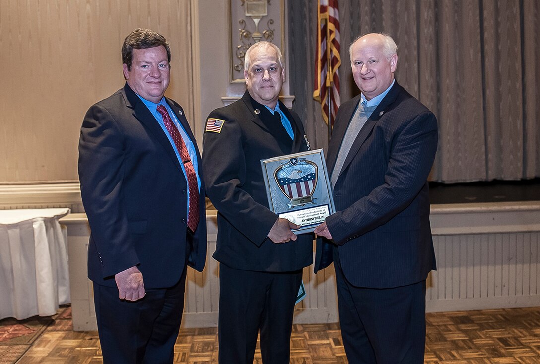 Anthony Hulin, DLA Fire and Emergency Services, won first place in the Productivity or Process Improvement Award for an individual from a small agency at the 39th Annual Federal Executive Association’s Excellence in Government Awards luncheon. He is pictured with Dan Bell (left), DSCC Installation Site Director, and Thomas Leach, director, HUD Columbus Field Office.