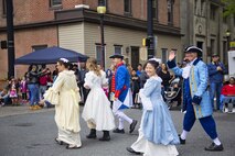 Col. Kevin Gordon, 436th Airlift Wing vice commander, marches with his family and Col. Eric Brandes, 512th Maintenance Group commander and his wife, as they lead the parade May 8, 2016, during the Old Dover Days parade in downtown Dover, Del. Old Dover Days is a celebration of Delaware’s history as the first state. (U.S. Air Force photo/Capt. Bernie Kale)