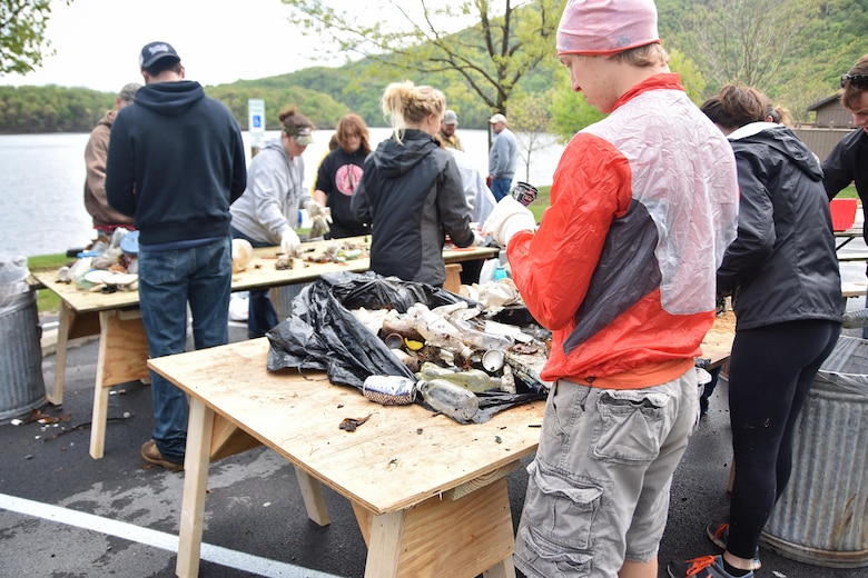 Volunteers hand sort debris for recyclables during the Raystown Lake Cleanup Day, May 7, 2016. Besides large amounts of plastic and glass, volunteers also collected tires, plywood, and even a computer monitor. 130 volunteers came together to collect debris from remote areas of Raystown Lake’s 110 miles of shoreline during the annual event