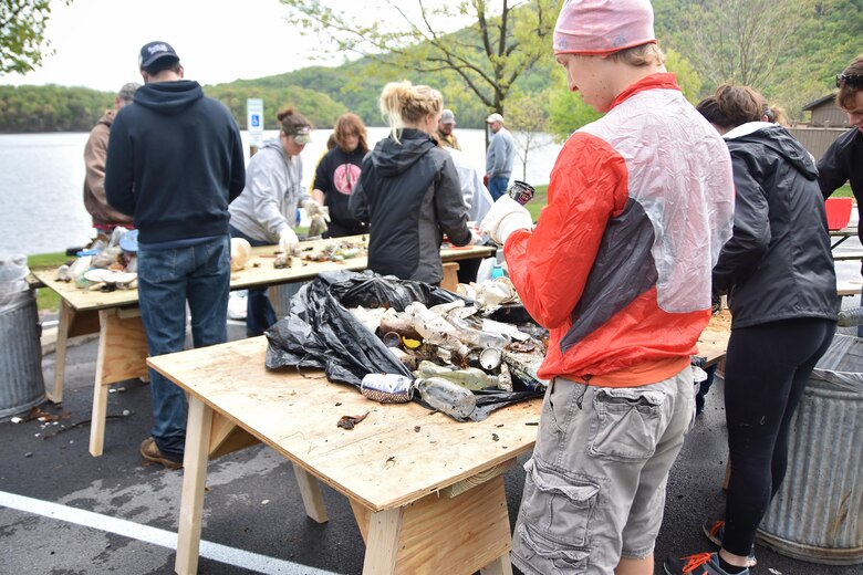 Volunteers hand sort debris for recyclables during the Raystown Lake Cleanup Day, May 7, 2016. Besides large amounts of plastic and glass, volunteers also collected tires, plywood, and even a computer monitor. 130 volunteers came together to collect debris from remote areas of Raystown Lake’s 110 miles of shoreline during the annual event