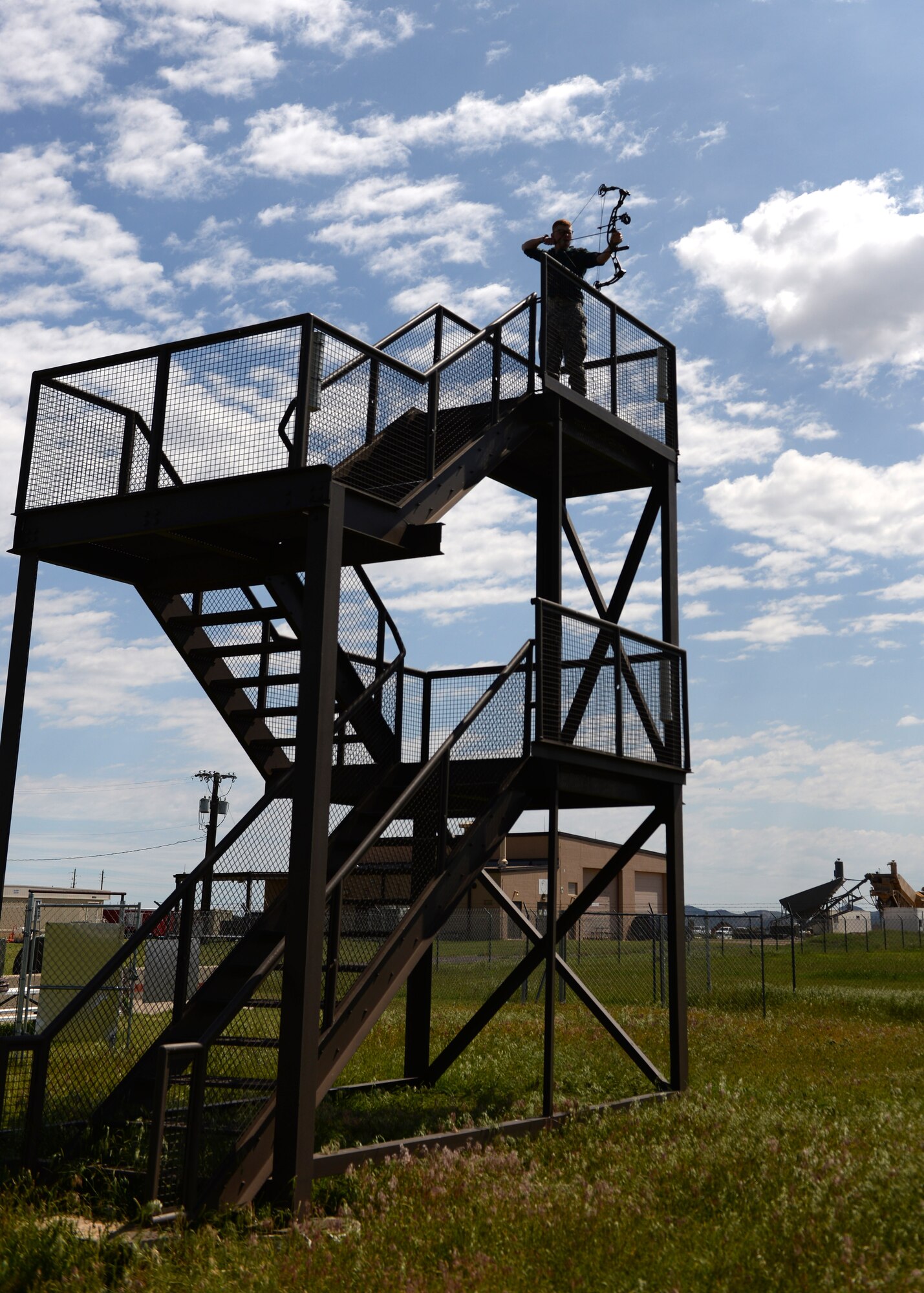 An Airman prepares to fire his compound bow from the tower at the archery range, May 12, 2016, Altus Air Force Base, Okla. Altus AFB Outdoor Recreation offers a wide range of equipment, events and entertainment for Airmen and their families. 