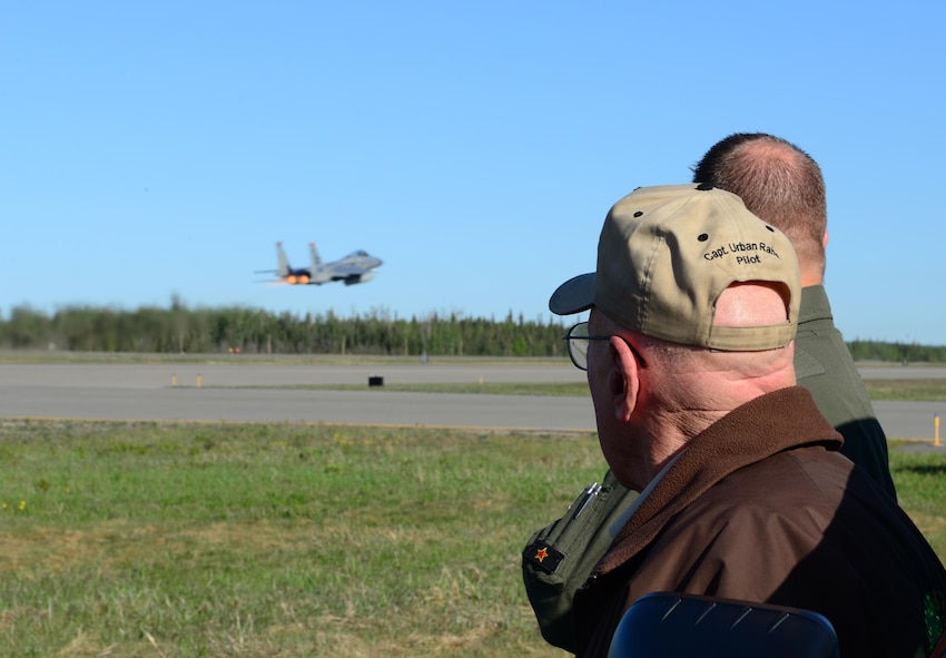 Urban Rahoi, a World War II veteran and Fairbanks, Alaska resident, watches takeoffs with U.S Air Force Col. Michael Winkler, the 354th Fighter Wing commander May 13, 2016, at Eielson Air Force Base, Alaska. Rahoi spent the morning reminiscing with Winkler about his time at the base decades ago and learning about the new aircraft and technology used today. (U.S. Air Force photo by Airman 1st Class Cassandra Whitman/Released)