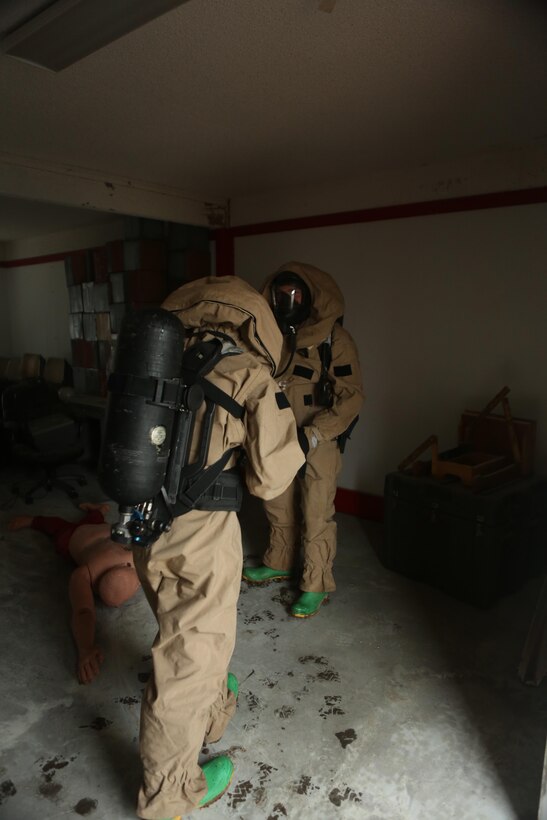 Marines with the Chemical Biological Radiological and Nuclear (CBRN) unit train to assess a casualty during Awareness Consequence Management training aboard Marine Corps Air Station Miramar, Calif., May 6. The ACM training is conducted by CBRN once a month to maintain mission readiness. (U.S. Marine Corps photo by Pfc. Liah Kitchen/Released)