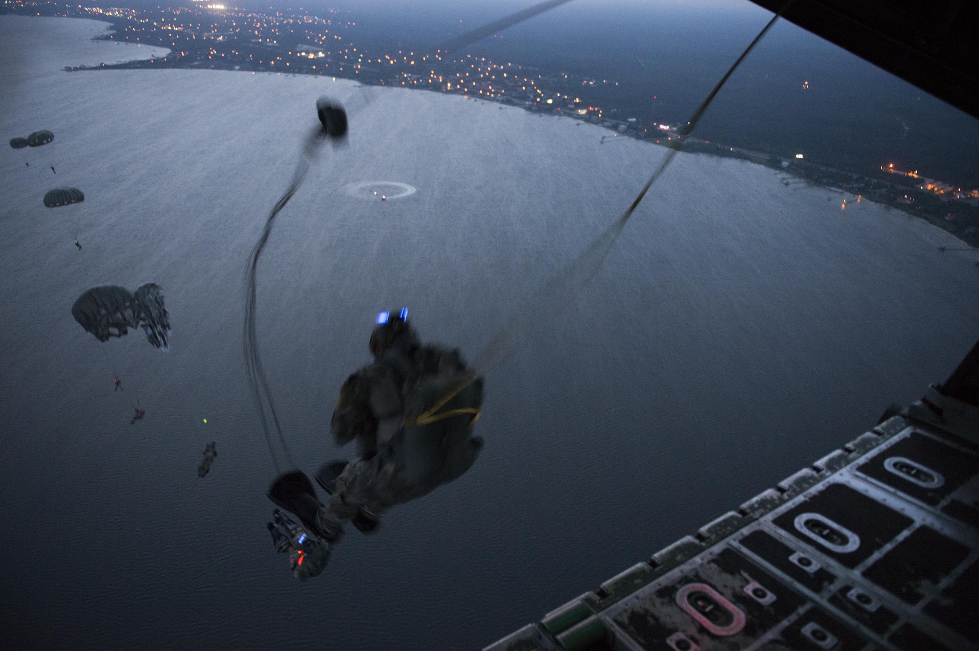 Special Tactics Airmen, assigned to the 24th Special Operations Wing, conduct static line jump operations from a U.S.Air Force MC-130H Combat Talon II assigned to the 15th Special Operations Squadron during Emerald Warrior, over a training range near Hurlburt Field, Fla., May 9, 2016. Emerald Warrior is a U.S. Special Operation Command-sponsored mission rehearsal exercise during which joint special operations forces train to respond to real and emerging worldwide threats. (U.S. Air Force photo by Tech. Sgt. Gregory Brook)