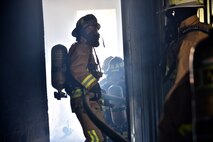 932nd Airlift Wing Civil Engineer Squadron firefighters feel the heat of a class A fire with temperatures exceeding 600 degrees fahrenheit during live fire training for structural fires May 14, 2016, Scott Air Force Base, Illinois.  (U.S. Air Force photo by Tech. Sgt. Christopher Parr)