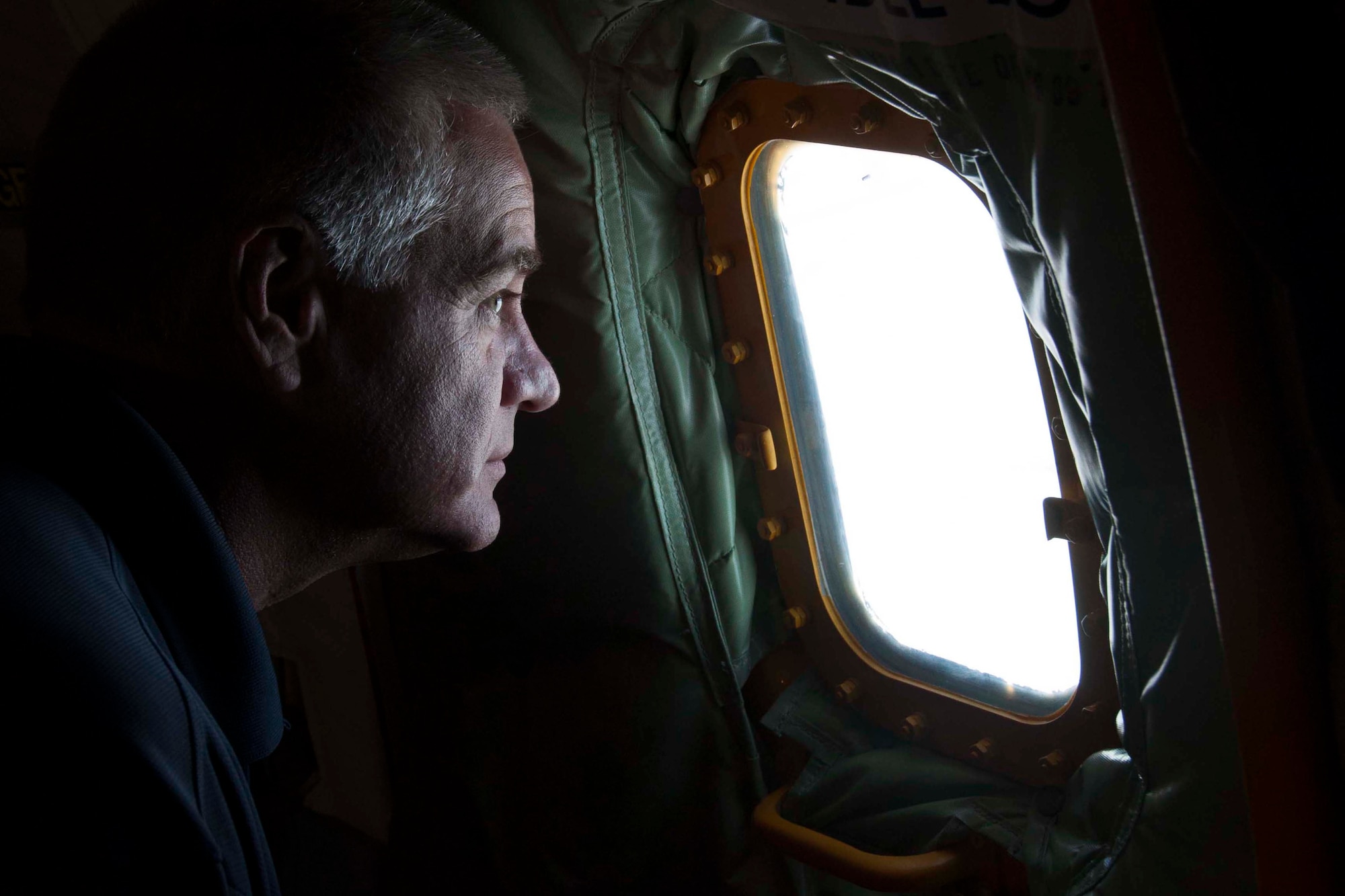 Tom Madden peers out the window of a KC-135 Stratotanker during a refueling mission out of Barksdale Air Force Base, La., May 14, 2016.  Madden, a Louisiana State Trooper, took part in an Employer Appreciation Day hosted by the 307th Bomb Wing.  Members of the 307th BW nominated their employers to spend the day learning more about the U.S. Air Force Reserve and 307th BW and enjoying a refueling flight.  (U.S. Air Force photo by Tech. Sgt. Ted Daigle/released)  