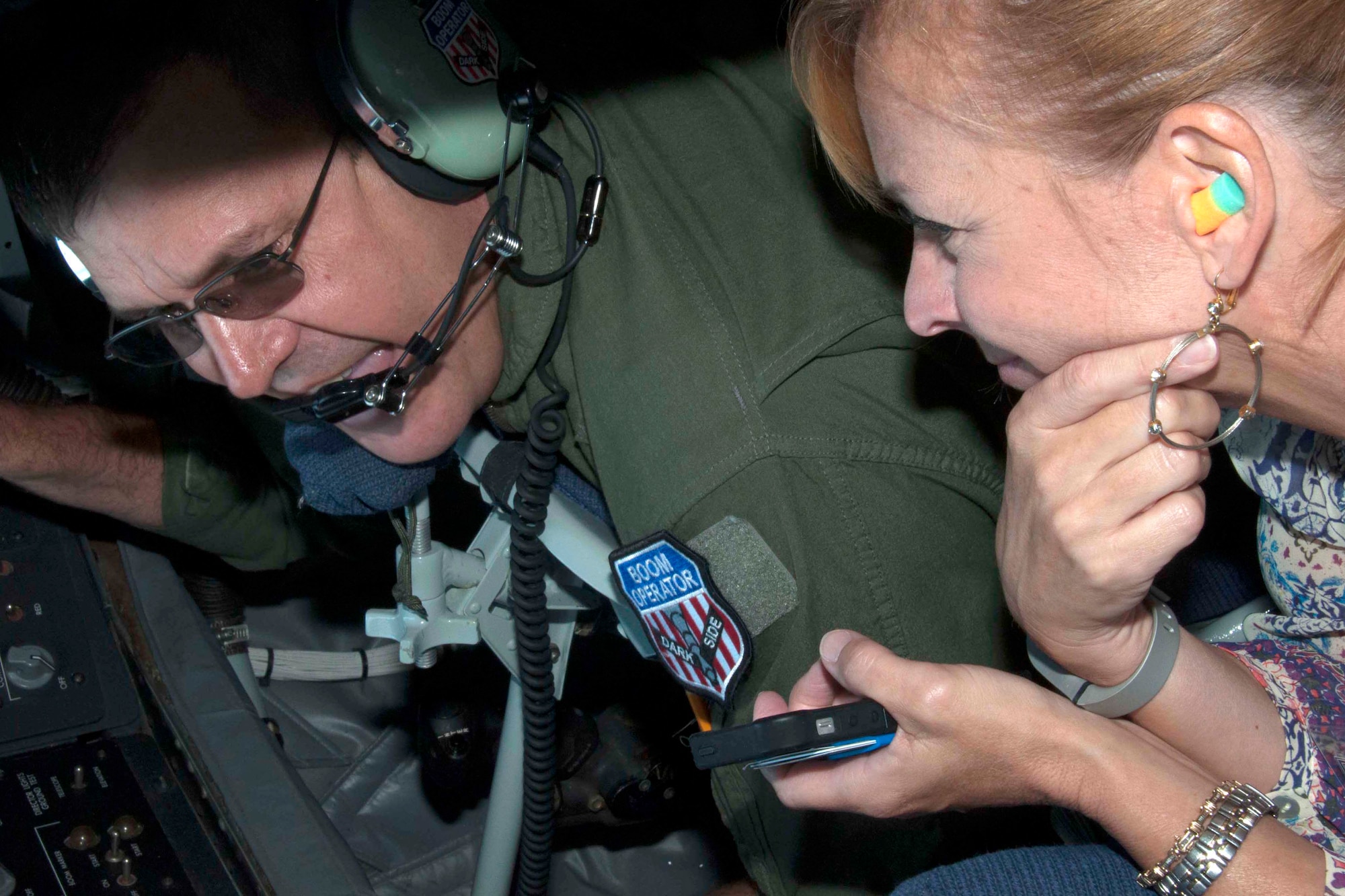 U.S. Air Force Chief Master Sgt. Jeff Henry, a boom operator from the 434th Air Refueling Wing, Grissom Air Reserve Base, Ind., answers a question from Rachel Thrasher prior to refueling a B-52 Stratofortress May 14, 2016.  Thrasher took part in the Employer Appreciation Day hosted by the 307th Bomb Wing, Barksdale Air Force Base, La.  The event is designed to teach employers about the Air Force Reserve and the 307th BW.  (U.S. Air Force photo by Tech. Sgt. Ted Daigle/released)