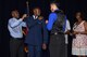 Friends and family pin gold bars on U.S. Air Force 2nd Lt. Hakeem Regis’ service coat during the Air Force ROTC Detachment 847 commissioning ceremony at Angelo State University's C. J. Davidson Conference Center, May 13, 2016. Detachment 847 commissioned four cadets into the Air Force during the ceremony. (U.S. Air Force photo by Staff Sgt. Laura R. McFarlane/Released)
