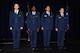 U.S. Air Force 2nd Lts. Quinn Sokolnicki, Hakeem Regis, Ruben Perez, and Matthew Cornman, prepare to lead the audience in the singing of the Air Force song following the Air Force ROTC Detachment 847 commissioning ceremony at Angelo State University's C. J. Davidson Conference Center, May 13, 2016. The ceremony included former or current military officers swearing in the cadets, friends and family members pinning the rank to their uniform, and former or current enlisted members rendering the new officers their first salute. (U.S. Air Force photo by Staff Sgt. Laura R. McFarlane/Released)